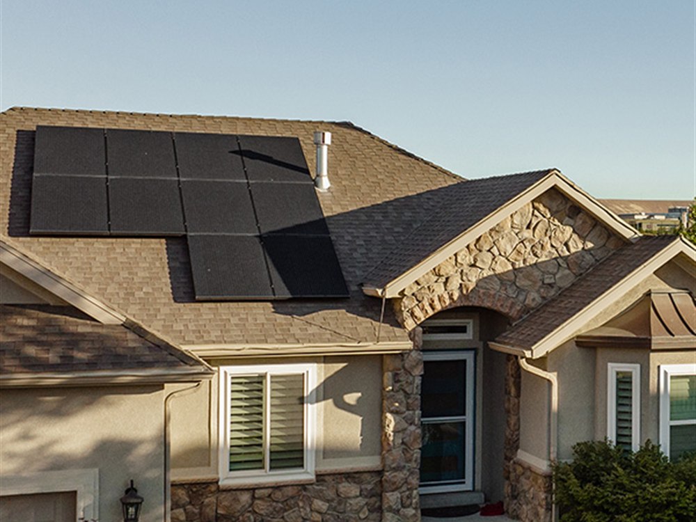 LGCY Power installation on a suburban home with black-on-black rooftop solar panels